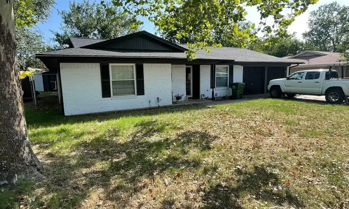 Professional roofing crew working on a residential roof in Montclair